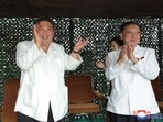 North Korea's leader Kim Jong Un applauding the test firing of a new intercontinental ballistic missile (ICBM) "Hwasong-18",