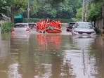 NDRF personnel used boats to rescue a family from a flooded bungalow in Civil Lines. NDRF personnel used boats to rescue a family from a flooded bungalow in Civil Lines.