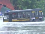 A police van seen stuck in a waterlogged road in Delhi. A police van seen stuck in a waterlogged road in Delhi.