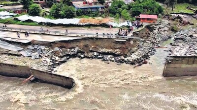 A view of a damaged road in Manali, caused by flooding in view of incessant rains in Himachal Pradesh, on Wednesday. (ANI) A view of a damaged road in Manali, caused by flooding in view of incessant rains in Himachal Pradesh, on Wednesday. (ANI)