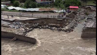 A view of the damaged road depicting an aftermath of the flood occurred by the incessant monsoon rains, in Manali, Himachal Pradesh on Wednesday. (ANI) A view of the damaged road depicting an aftermath of the flood occurred by the incessant monsoon rains, in Manali, Himachal Pradesh on Wednesday. (ANI)