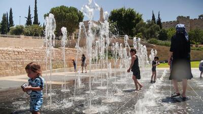 Children play in a water fountain during a heatwave, near the walls of Jerusalem's Old City on Thursday. (REUTERS) Children play in a water fountain during a heatwave, near the walls of Jerusalem's Old City on Thursday. (REUTERS)
