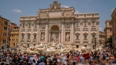 Tourists visit the Trevi Fountain in Rome. Crowds are packing the Colosseum, the Louvre, the Acropolis and other major attractions as tourism exceeds 2019 records in some of Europe’s most popular destinations. (AP Photo/Andrew Medichini) Tourists visit the Trevi Fountain in Rome. Crowds are packing the Colosseum, the Louvre, the Acropolis and other major attractions as tourism exceeds 2019 records in some of Europe’s most popular destinations. (AP Photo/Andrew Medichini)