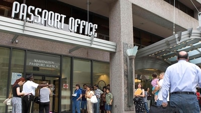 (FILES) People line up outside the US Passport Office in Washington, DC, June 20, 2007. It is an "unprecedented demand", which comes up against the need to "rebuild" a service practically dismantled during covid, US Secretary od State Antony Blinken acknowledged, as travel surges post-Covid. The US State Department asked citizens to "check the expiration date of the document and renew it" as soon as possible before traveling. (AFP) (FILES) People line up outside the US Passport Office in Washington, DC, June 20, 2007. It is an "unprecedented demand", which comes up against the need to "rebuild" a service practically dismantled during covid, US Secretary od State Antony Blinken acknowledged, as travel surges post-Covid. The US State Department asked citizens to "check the expiration date of the document and renew it" as soon as possible before traveling. (AFP)