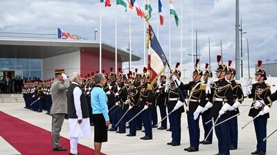 France's Prime Minister Elisabeth Borne (3L) and India's Prime Minister Narendra Modi (2L) stand in front of French Republican Guards at the Orly airport in Orly, Paris' suburb, (PTI) France's Prime Minister Elisabeth Borne (3L) and India's Prime Minister Narendra Modi (2L) stand in front of French Republican Guards at the Orly airport in Orly, Paris' suburb, (PTI)