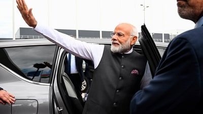 Prime Minister Narendra Modi waves as he arrives at the Orly airport in Orly, Paris' suburb, Thursday. (PTI) Prime Minister Narendra Modi waves as he arrives at the Orly airport in Orly, Paris' suburb, Thursday. (PTI)