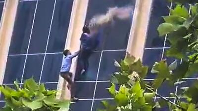 Greater Noida: People attempt to jump after a fire broke out at a shopping complex in Greater Noida on Thursday (PTI/Video Grab) Greater Noida: People attempt to jump after a fire broke out at a shopping complex in Greater Noida on Thursday (PTI/Video Grab)
