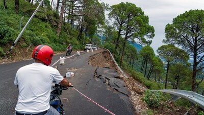 A commuter waits for his turn to ride on a road in Dharamshala, Himachal Pradesh. (AP) A commuter waits for his turn to ride on a road in Dharamshala, Himachal Pradesh. (AP)