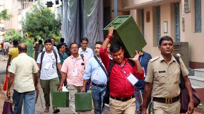 Polling officials carrying ballot boxes and other election material on the way to their respective polling booths ahead of the West Bengal panchayat elections, at Balurghat in South Dinajpur district, July 7. (PTI)