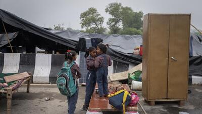 Schoolgirls displaced by the rising water level in New Delhi on Thursday. (Reuters) Schoolgirls displaced by the rising water level in New Delhi on Thursday. (Reuters)