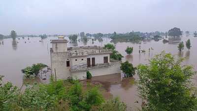 The river is flowing 6 feet above danger mark; At least 20 villages affected, with nearly 25,000 acres of agricultural land submerged The river is flowing 6 feet above danger mark; At least 20 villages affected, with nearly 25,000 acres of agricultural land submerged