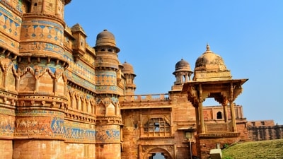 Gwalior Fort: Gwalior Fort is perched on a hilltop in the city of Gwalior. This imposing structure boasts a rich history that spans over a thousand years. The fort showcases a blend of Rajput and Mughal architectural styles and houses several palaces, temples, and ornate structures. (Chirag Vashist on Unsplash)
