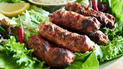 Seekh Kebab (Delhi): Seekh Kebabs are long, cylindrical kababs made with minced meat, typically lamb or beef, mixed with aromatic spices and grilled on skewers. They are often served with mint chutney, onion rings, and lemon wedges. Delhi is famous for its street food culture, and you can find delicious Seekh Kebabs in various food markets and kebab joints across the city. (Pinterest) Seekh Kebab (Delhi): Seekh Kebabs are long, cylindrical kababs made with minced meat, typically lamb or beef, mixed with aromatic spices and grilled on skewers. They are often served with mint chutney, onion rings, and lemon wedges. Delhi is famous for its street food culture, and you can find delicious Seekh Kebabs in various food markets and kebab joints across the city. (Pinterest)
