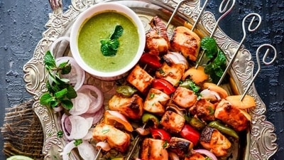 Tandoori Paneer Tikka (North India): Tandoori Paneer Tikka is a popular vegetarian kebab made with chunks of paneer (Indian cottage cheese) marinated in a mixture of yogurt and spices. The marinated paneer is then skewered and grilled in a tandoor (clay oven) or on a grill until it acquires a smoky and charred flavour. It is often served with mint chutney and onion rings. (Pinterest) Tandoori Paneer Tikka (North India): Tandoori Paneer Tikka is a popular vegetarian kebab made with chunks of paneer (Indian cottage cheese) marinated in a mixture of yogurt and spices. The marinated paneer is then skewered and grilled in a tandoor (clay oven) or on a grill until it acquires a smoky and charred flavour. It is often served with mint chutney and onion rings. (Pinterest)