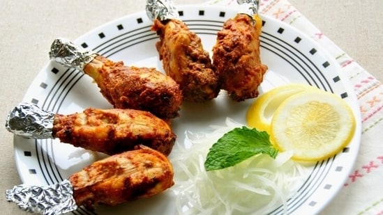 Tangdi Kebab (Punjab): Tangdi Kebab, also known as Chicken Drumstick Kebab, is a Punjabi speciality. The drumsticks are marinated in a mixture of yogurt and spices, including ginger, garlic, and garam masala, and then grilled or baked to perfection. Tangdi Kebabs are flavorful and make for a great appetizer or main course.(Pinterest)