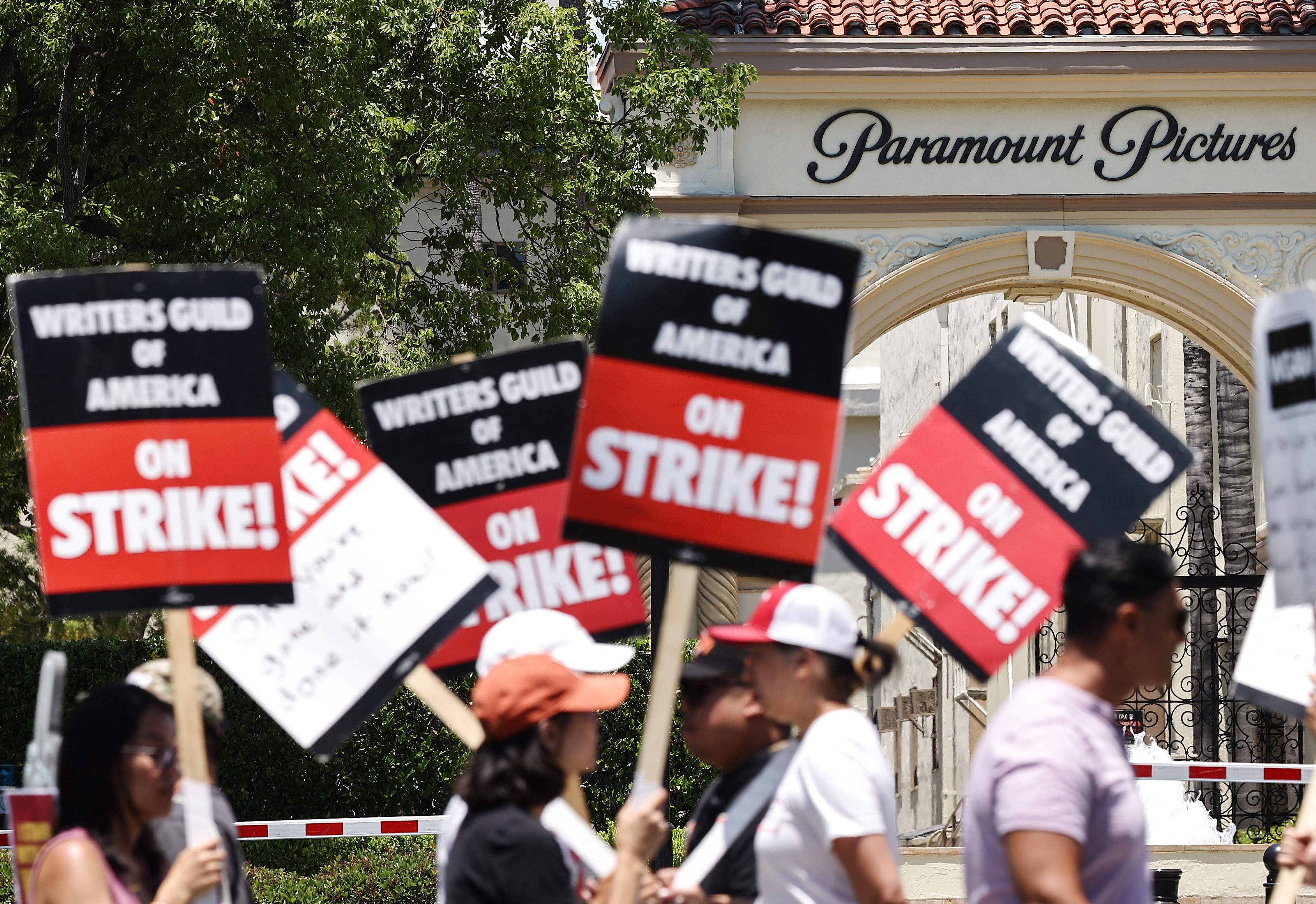 Striking WGA (Writers Guild of America) workers picket outside Paramount Studios on July 12, 2023 in Los Angeles, California. Striking WGA (Writers Guild of America) workers picket outside Paramount Studios on July 12, 2023 in Los Angeles, California.