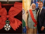 (L) Grand Cross of the Legion of Honour. (R) PM Narendra Modi with French President Emmanuel Macron (L) Grand Cross of the Legion of Honour. (R) PM Narendra Modi with French President Emmanuel Macron