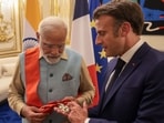 French President Emmanuel Macron bestows the Grand Cross of the Legion of Honor on Prime Minister Narendra Modi. 