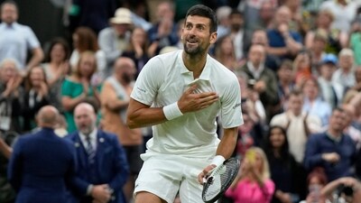 Serbia's Novak Djokovic reacts after beating Italy's Jannik Sinner to win their men's singles semifinal match on day twelve of the Wimbledon (AP)