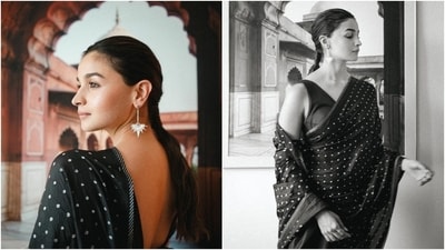 Actor Alia Bhatt travelled to Delhi recently to attend an Amazon Prime Video event. The star shared pictures of her elegant look for the occasion on Instagram. The post shows her embracing old-world charm in a beauteous black saree embellished with gold sequins and a striped patti border. She wore the six yards with a sleeveless black blouse featuring a plunging V neckline, a backless detail, and a fitted bust. (Instagram) Actor Alia Bhatt travelled to Delhi recently to attend an Amazon Prime Video event. The star shared pictures of her elegant look for the occasion on Instagram. The post shows her embracing old-world charm in a beauteous black saree embellished with gold sequins and a striped patti border. She wore the six yards with a sleeveless black blouse featuring a plunging V neckline, a backless detail, and a fitted bust. (Instagram)