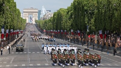 Marching to the tune of 'saare jahan se achcha', the 269-member Indian tri-services contingent participated in the parade and joined the flypast. Marching to the tune of 'saare jahan se achcha', the 269-member Indian tri-services contingent participated in the parade and joined the flypast.