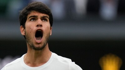 Spain's Carlos Alcaraz reacts after winning a point against Russia's Daniil Medvedev in a men's singles semifinal match on day twelve of the Wimbledon tennis championships (AP) Spain's Carlos Alcaraz reacts after winning a point against Russia's Daniil Medvedev in a men's singles semifinal match on day twelve of the Wimbledon tennis championships (AP)