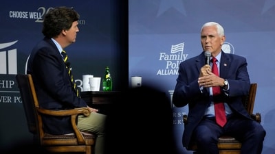 Republican presidential candidate former Vice President Mike Pence talks with moderator Tucker Carlson, left, during the Family Leadership Summit, Friday, July 14, 2023, in Des Moines, Iowa. (AP Photo/Charlie Neibergall) (AP) Republican presidential candidate former Vice President Mike Pence talks with moderator Tucker Carlson, left, during the Family Leadership Summit, Friday, July 14, 2023, in Des Moines, Iowa. (AP Photo/Charlie Neibergall) (AP)