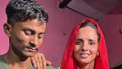 Sachin Meena (L) and Seema Haider at their residence in Rabupura village, about 90 km from New Delhi. (AFP)