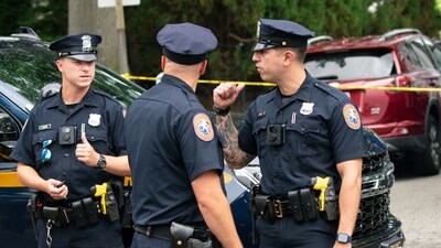 Police officers stand guard near the house where a suspect has been taken into custody on New York's Long Island in connection with a long-unsolved string of killings, known as the Gilgo Beach murders, Friday, July 14, 2023, in Massapequa Park, N.Y. (AP Photo/Eduardo Munoz Alvarez) (AP)