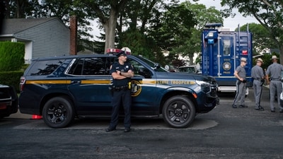 Police officers stand guard near the house where a suspect has been taken into custody on New York's Long Island in connection with a long-unsolved string of killings, known as the Gilgo Beach murders, Friday, July 14, 2023, in Massapequa, N.Y. (AP Photo/Eduardo Munoz Alvarez) (AP) Police officers stand guard near the house where a suspect has been taken into custody on New York's Long Island in connection with a long-unsolved string of killings, known as the Gilgo Beach murders, Friday, July 14, 2023, in Massapequa, N.Y. (AP Photo/Eduardo Munoz Alvarez) (AP)