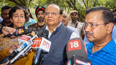 Delhi Lt Governor VK Saxena and CM Arvind Kejriwal address the media after inspecting the damaged drain regulator at Vikas Marg, ITO, in New Delhi on Friday. (PTI) Delhi Lt Governor VK Saxena and CM Arvind Kejriwal address the media after inspecting the damaged drain regulator at Vikas Marg, ITO, in New Delhi on Friday. (PTI)