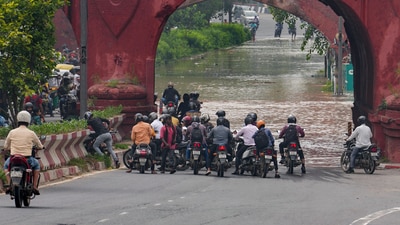 Commuters at a flooded road near the Red Fort as the Yamuna river flooded low-lying areas of New Delhi. (PTI) Commuters at a flooded road near the Red Fort as the Yamuna river flooded low-lying areas of New Delhi. (PTI)