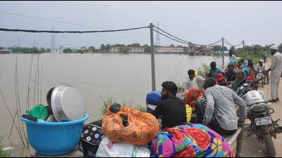 Residents moving to safer places on Thursday. (HT PHOTO)