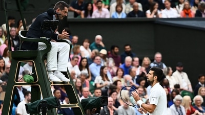 Serbia's Novak Djokovic (L) argues with the umpire following a point deduction for shouting as he plays against to Italy's Jannik Sinner during their men's singles semi-finals tennis match (AFP) Serbia's Novak Djokovic (L) argues with the umpire following a point deduction for shouting as he plays against to Italy's Jannik Sinner during their men's singles semi-finals tennis match (AFP)
