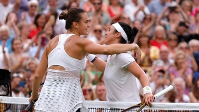 Belarus’ Aryna Sabalenka and Tunisia’s Ons Jabeur hug at the net after their semi final match (REUTERS)