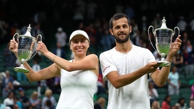 Croatia’s Mate Pavic and Ukraine’s Lyudmyla Kichenok celebrate with their trophies after winning their mixed doubles final match against Belgium’s Joran Vliegen and China’s Yifan Xu (REUTERS)