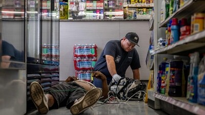PHOENIX, ARIZONA - JULY 13: A person receives medical attention after collapsing in a convenience store on July 13, 2023 in Phoenix, Arizona. EMT was called after the person said they experienced hot flashes, dizziness, fatigue and chest pain. Today marks the Phoenix area's 14th consecutive day of temperatures exceeding 110 degrees Fahrenheit. Record-breaking temperatures continue soaring as prolonged heatwaves sweep across the Southwest. Brandon Bell/Getty Images/AFP (Photo by Brandon Bell / GETTY IMAGES NORTH AMERICA / Getty Images via AFP) (Getty Images via AFP) PHOENIX, ARIZONA - JULY 13: A person receives medical attention after collapsing in a convenience store on July 13, 2023 in Phoenix, Arizona. EMT was called after the person said they experienced hot flashes, dizziness, fatigue and chest pain. Today marks the Phoenix area's 14th consecutive day of temperatures exceeding 110 degrees Fahrenheit. Record-breaking temperatures continue soaring as prolonged heatwaves sweep across the Southwest. Brandon Bell/Getty Images/AFP (Photo by Brandon Bell / GETTY IMAGES NORTH AMERICA / Getty Images via AFP) (Getty Images via AFP)