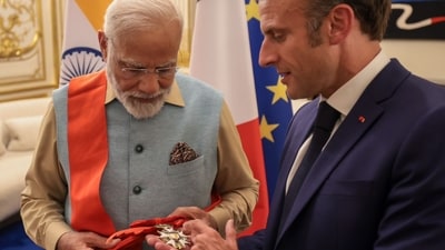 French President Emmanuel Macron bestows the Grand Cross of the Legion of Honor on Prime Minister Narendra Modi. French President Emmanuel Macron bestows the Grand Cross of the Legion of Honor on Prime Minister Narendra Modi.