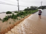 A view of a road submerged by a flooded river caused by heavy rain in Cheongju, South Korea on Friday.