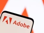 FILE PHOTO: Adobe logo is seen on smartphone in this illustration taken June 13, 2022. (REUTERS/Dado Ruvic/Illustration/File Photo)