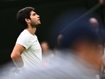 Spain's Carlos Alcaraz reacts as he plays against Russia's Daniil Medvedev during their men's singles semi-finals tennis match on the twelfth day of the 2023 Wimbledon Championships