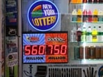 A Powerball and Mega Millions lottery advertisement is displayed at a newsstand on July 12, 2023 in New York City. A Powerball and Mega Millions lottery advertisement is displayed at a newsstand on July 12, 2023 in New York City.