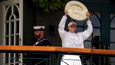 Czech Republic's Marketa Vondrousova celebrates as she shows the trophy from the balcony of Centre Court after beating Tunisia's Ons Jabeur to win the final of the women’s singles on day thirteen of the Wimbledon tennis championships (AP) Czech Republic's Marketa Vondrousova celebrates as she shows the trophy from the balcony of Centre Court after beating Tunisia's Ons Jabeur to win the final of the women’s singles on day thirteen of the Wimbledon tennis championships (AP)