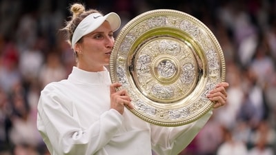 Czech Republic's Marketa Vondrousova celebrates with the trophy after beating Tunisia's Ons Jabeur to win the final of the women's singles on day thirteen of the Wimbledon tennis championships (AP) Czech Republic's Marketa Vondrousova celebrates with the trophy after beating Tunisia's Ons Jabeur to win the final of the women's singles on day thirteen of the Wimbledon tennis championships (AP)