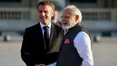 French President Emmanuel Macron and Prime Minister Narendra Modi shake hands. (Reuters)
