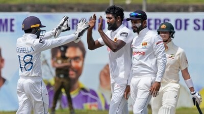 FILE - Sri Lanka's Prabath Jayasuriya, second left, celebrates taking the wicket of Australia's Mitchell Starc (AP) FILE - Sri Lanka's Prabath Jayasuriya, second left, celebrates taking the wicket of Australia's Mitchell Starc (AP)