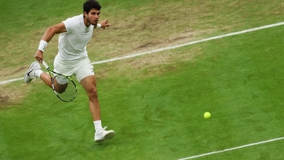 Spain's Carlos Alcaraz returns the ball to Russia's Daniil Medvedev during their men's singles semi-finals tennis match on the twelfth day of the 2023 Wimbledon Championships at The All England Lawn Tennis Club in Wimbledon (AFP) Spain's Carlos Alcaraz returns the ball to Russia's Daniil Medvedev during their men's singles semi-finals tennis match on the twelfth day of the 2023 Wimbledon Championships at The All England Lawn Tennis Club in Wimbledon (AFP)