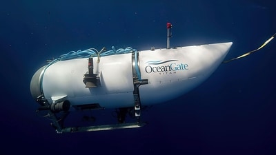 FILE - This photo provided by OceanGate Expeditions shows a submersible vessel named Titan used to visit the wreckage site of the Titanic. The wrecks of the Titanic and the Titan sit on the ocean floor, separated by 1,600 feet (490 meters) and 111 years of history. How they came together unfolded over an intense week that raised temporary hopes and left lingering questions. (OceanGate Expeditions via AP, File) (AP) FILE - This photo provided by OceanGate Expeditions shows a submersible vessel named Titan used to visit the wreckage site of the Titanic. The wrecks of the Titanic and the Titan sit on the ocean floor, separated by 1,600 feet (490 meters) and 111 years of history. How they came together unfolded over an intense week that raised temporary hopes and left lingering questions. (OceanGate Expeditions via AP, File) (AP)