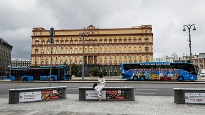 A woman uses her mobile phone in front of the Federal Security Service (FSB) building on Lubyanka Square in Moscow, Russia (REUTERS)