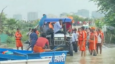 Many of these stranded people were discovered on Thursday when police officers and administration officials took a boat ride deep into the flooded areas. (ANI)